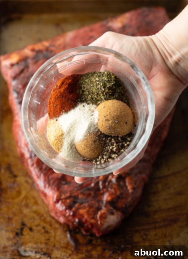 How to make tender slow cooker beef brisket by layering vegetables and then the seasoned meat