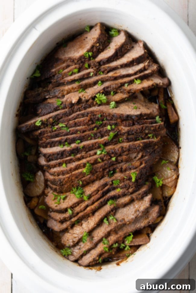 The best beef brisket with potatoes and onions, garnished and ready to serve