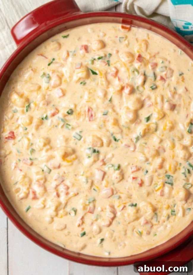 A tantalizing view of the hot shrimp dip, perfectly baked and ready for serving in a festive setting.