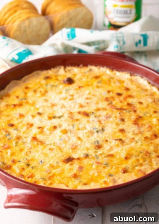 A close-up of the easy shrimp dip, showcasing its creamy texture and visible shrimp pieces, glistening from the oven.