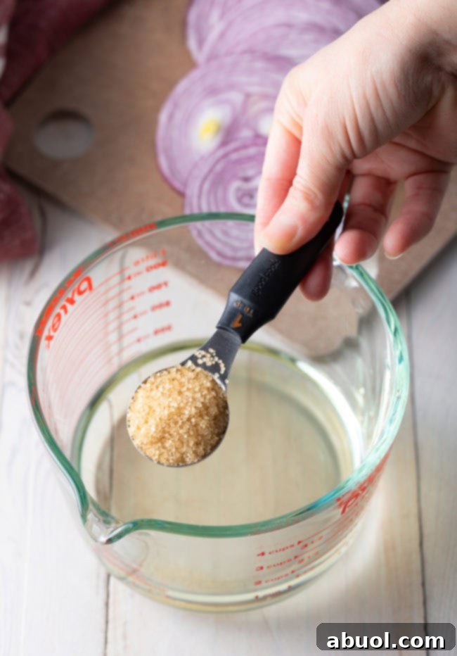 Detailed step-by-step process of how to quick pickle red onions, showing sliced onions being added to a jar