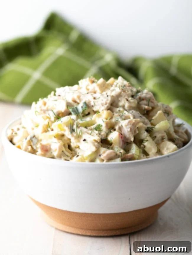 Side view of Homemade Chicken Salad in a white bowl.