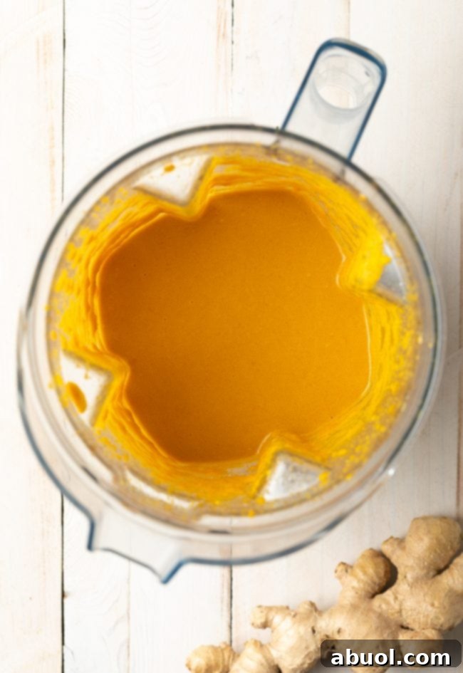 Japanese Ginger Dressing in a blender after being pureed to a smooth, creamy consistency, ready to be transferred to a serving container.