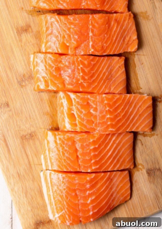 Salmon fillets on a cutting board. 