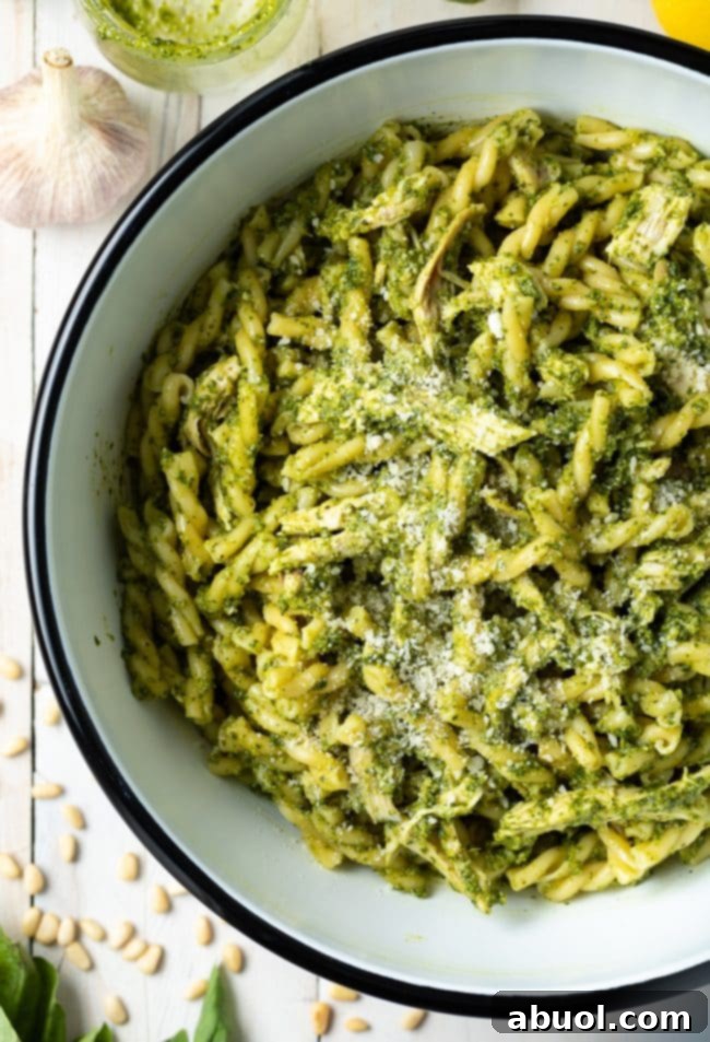 basil pesto chicken pasta in a large bowl with white interior