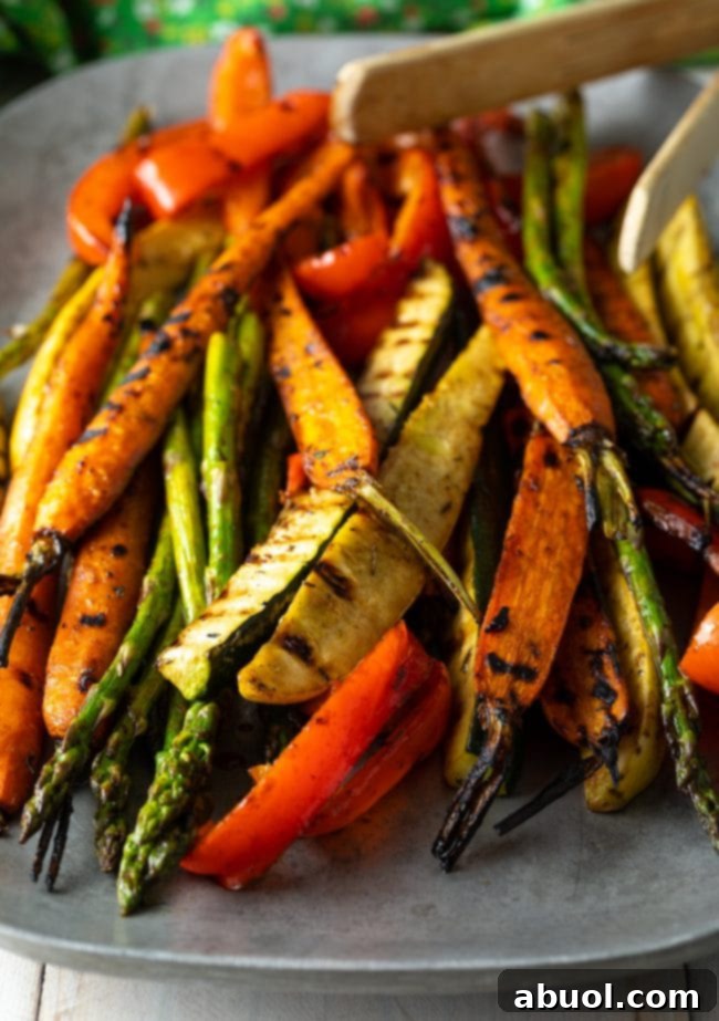 Master Marinade for Grilled Vegetables 13 A large serving platter piled high with a colorful and appealing selection of summer marinated grilled vegetables, ready to be served at a gathering.