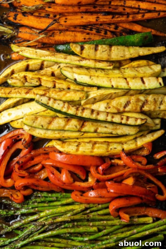 Master Marinade for Grilled Vegetables 10 A generous serving of summer marinated grilled vegetables, including zucchini, bell peppers, asparagus, and carrots, artfully arranged on a platter, ready to be enjoyed.