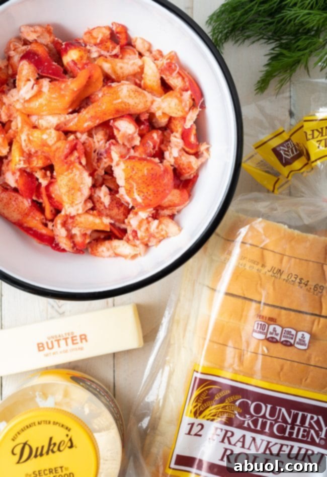 Large chunks of cooked lobster meat, bright red and ready for mixing into the salad.
