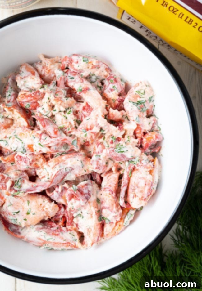 The finished lobster roll filling, perfectly mixed and showcasing its creamy, chunky texture.