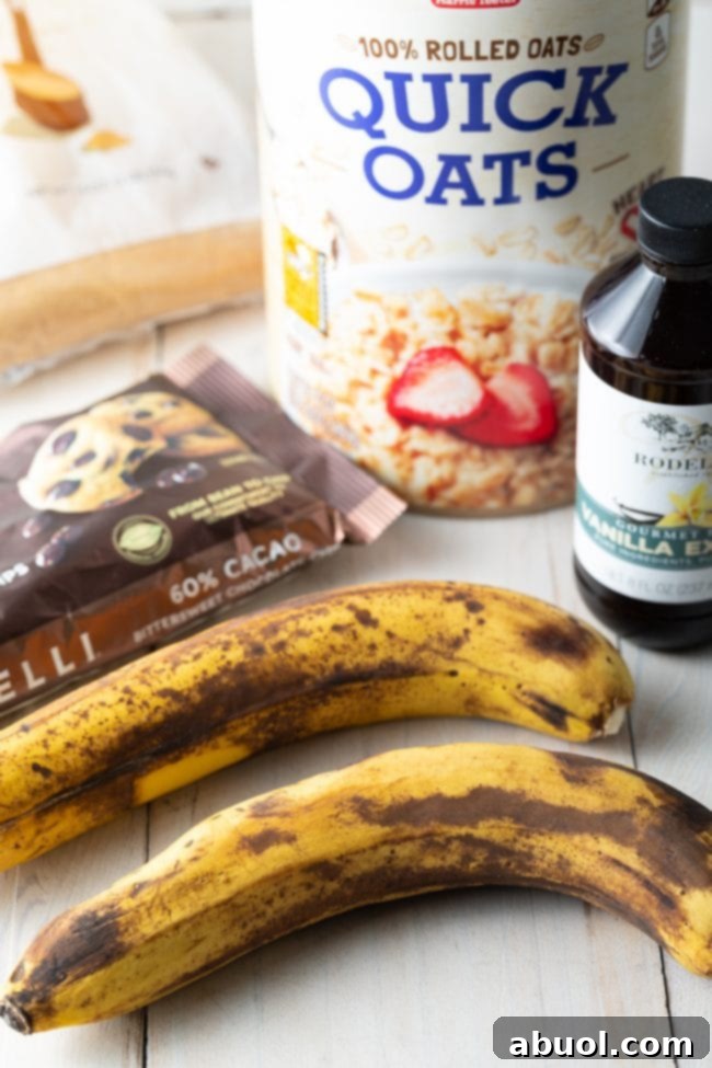 All the fresh ingredients required for baking banana oatmeal cookies laid out on a clean surface.