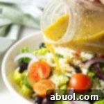 Zesty Homemade Greek Dressing 10 A small image of Greek Salad Dressing in a jar.
