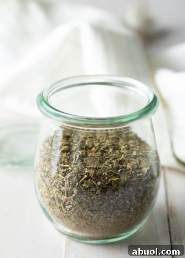 Freshly made homemade Italian seasoning in a glass jar