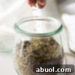 A small jar of homemade Italian seasoning