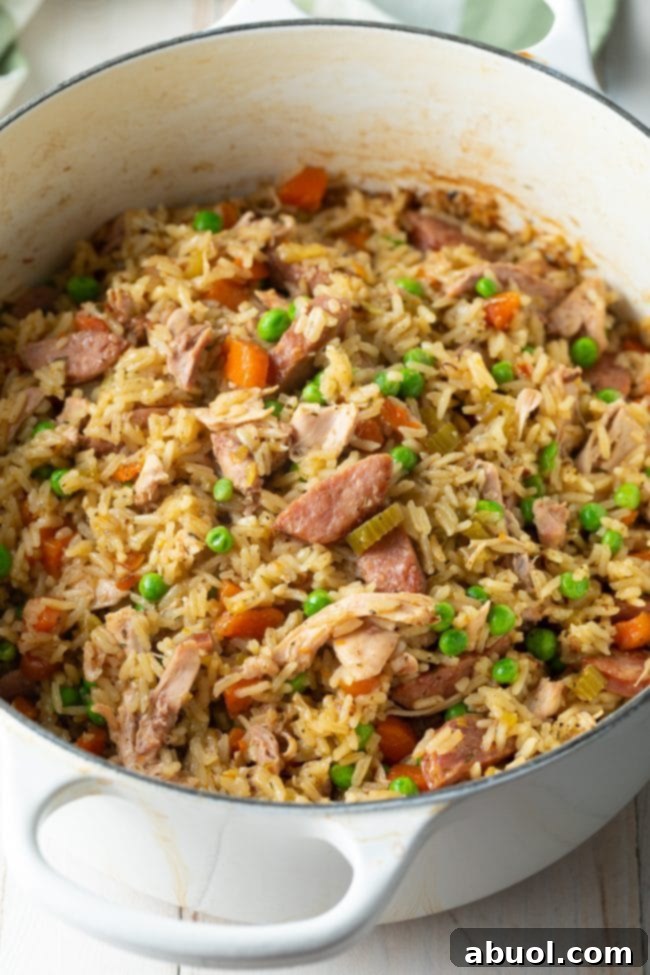 Southern Comfort Chicken Bog 2 Delicious Chicken Bog Recipe with sausage and peas in a large white pot, ready to serve and enjoy.