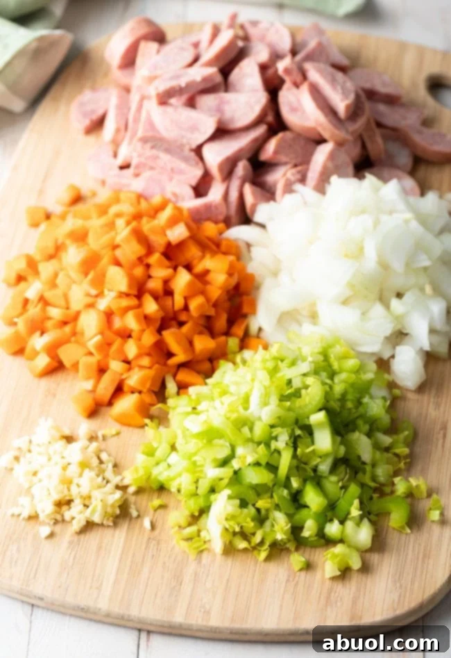 Southern Comfort Chicken Bog 5 Key ingredients for Chicken Bog: perfectly sliced kielbasa sausage, diced carrots, chopped onion, fresh celery, and minced garlic.