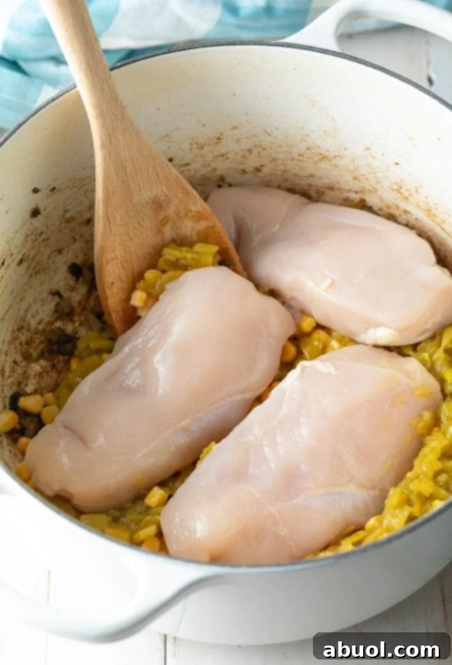 whole raw chicken breasts added to chili pot