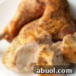A close-up of a succulent spatchcock turkey, perfectly roasted and ready for a meal.