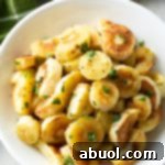 Printable recipe card image for Garlic Butter Roasted Parsnips