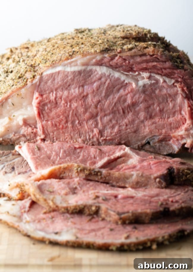 Smoked Prime Rib Perfection 3 traeger smoked prime rib recipe with ua jus - sliced on cutting board