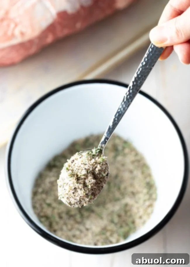 Smoked Prime Rib Perfection 5 seasoning for smoked prime rib - mixed in bowl and seasoning lifted with spoon