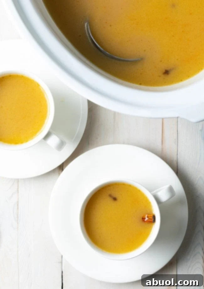 A beautifully prepared mug of hot buttered rum, adorned with a sprinkle of nutmeg, ready to be enjoyed.