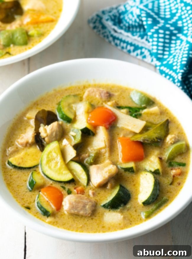 Vibrant Instant Pot Green Curry 2 Chicken curry in a white bowl.