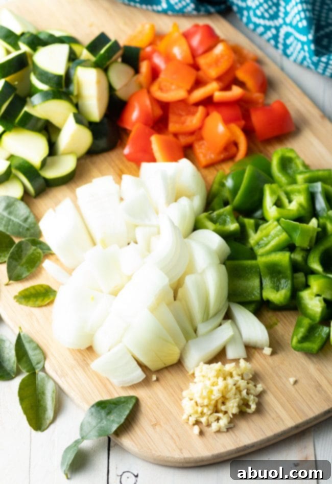 Vibrant Instant Pot Green Curry 5 Chopped veggies on a cutting board.