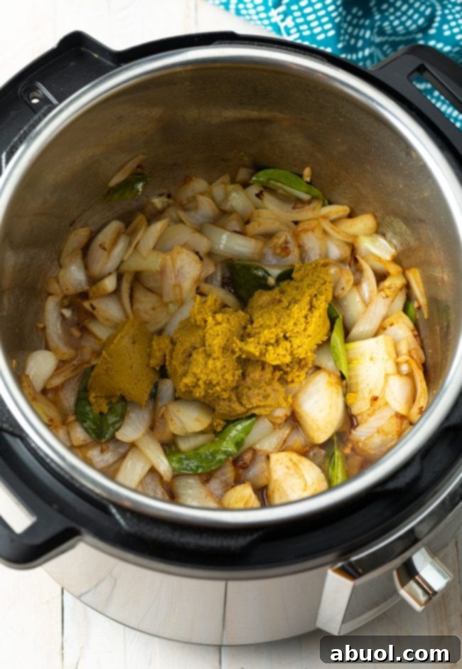 Vibrant Instant Pot Green Curry 6 Overhead of veggies and curry paste in Instant Pot.