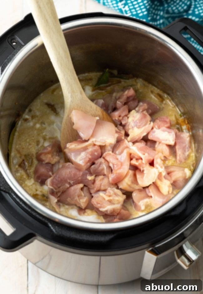 Vibrant Instant Pot Green Curry 7 Chicken pieces added to Instant Pot.