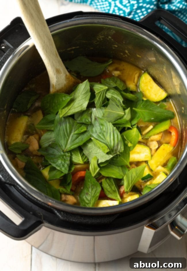 Vibrant Instant Pot Green Curry 9 Basil leaves added to Instant Pot.