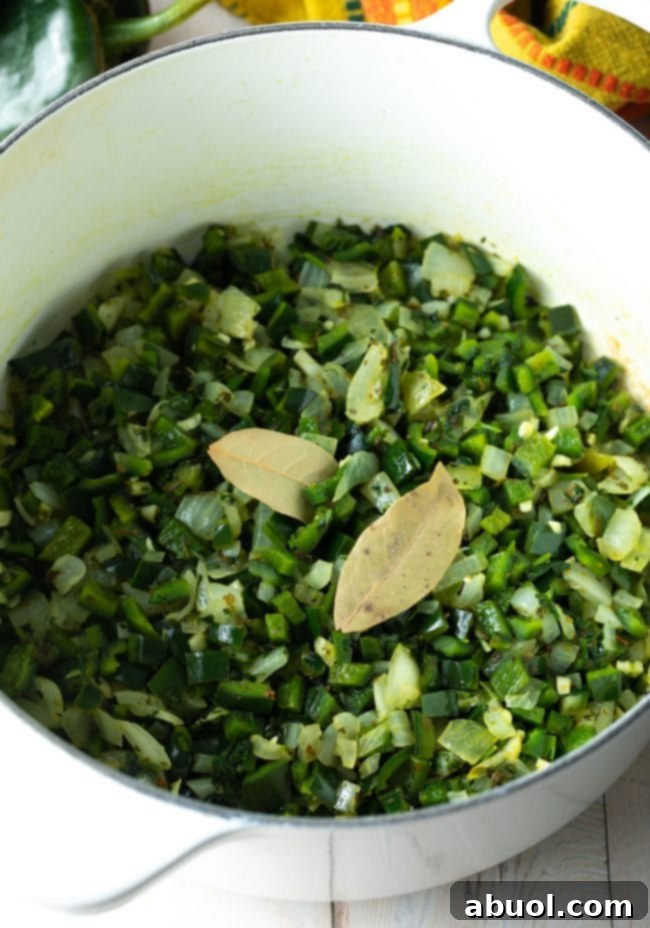 cooking peppers in a large pot with bay leaves and spices. 