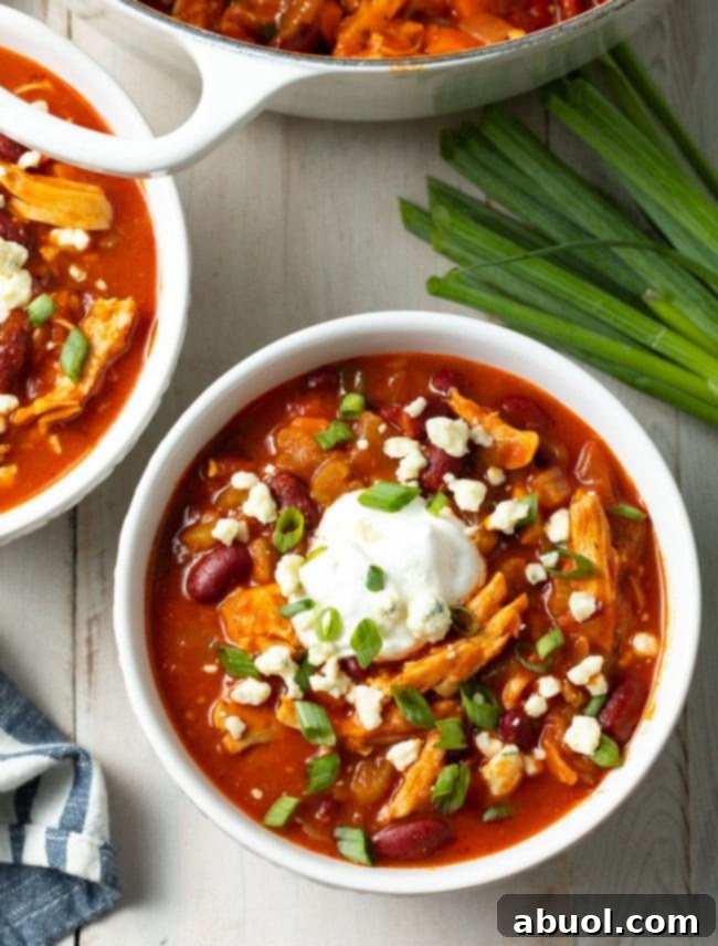 Easy Instant Pot Chicken Chili, garnished with fresh toppings.