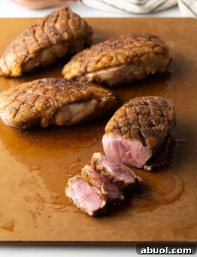 Expertly slicing pan-seared duck breast for serving