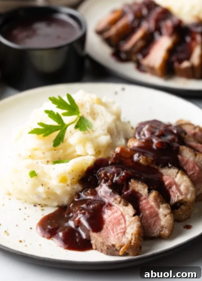 Delicious duck breast recipe served with blackberry sauce and creamy mashed potatoes