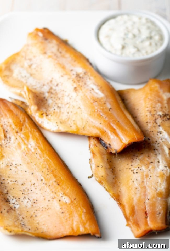 Fillets of smoked trout on a platter. 