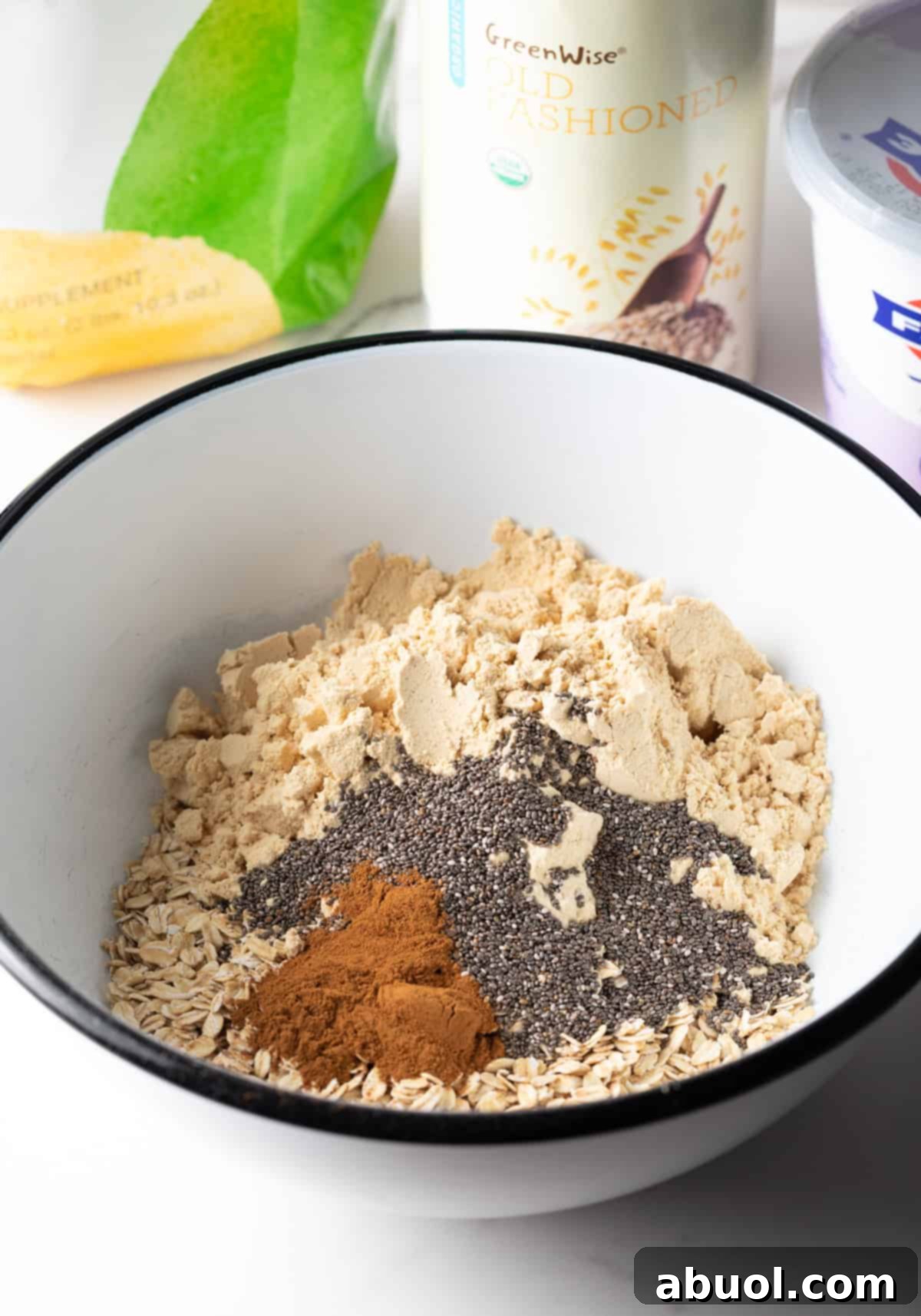 Dry ingredients for high-protein overnight oats in a white bowl