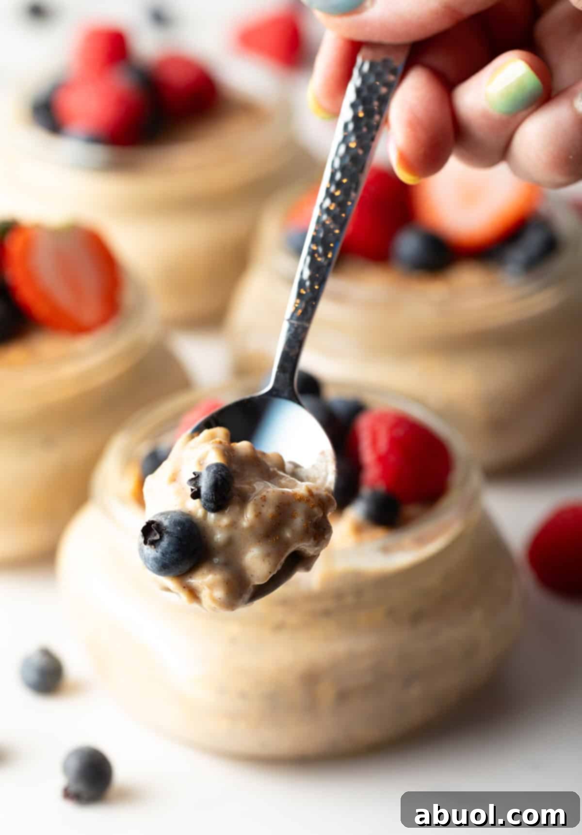 Spoonful of high-protein oatmeal over a glass jar