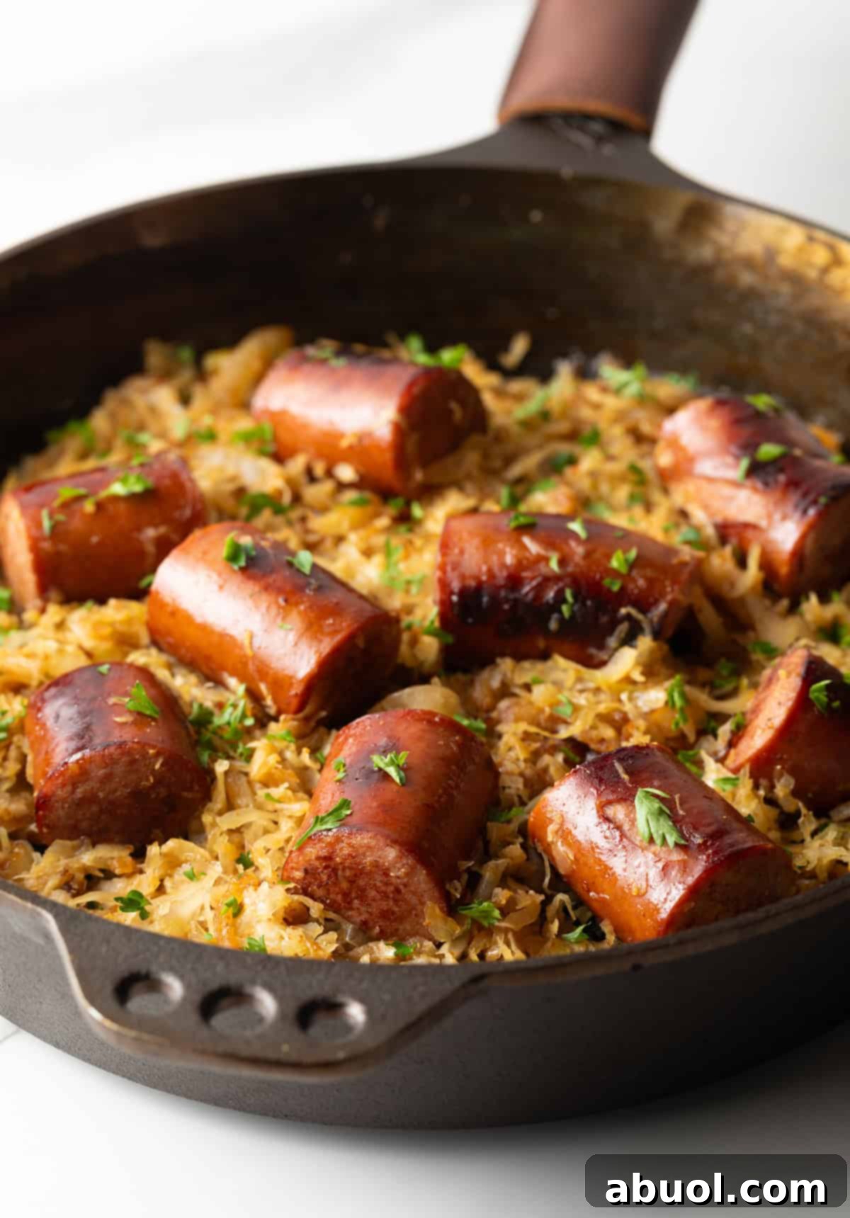 Skillet with kielbasa and sauerkraut cooked