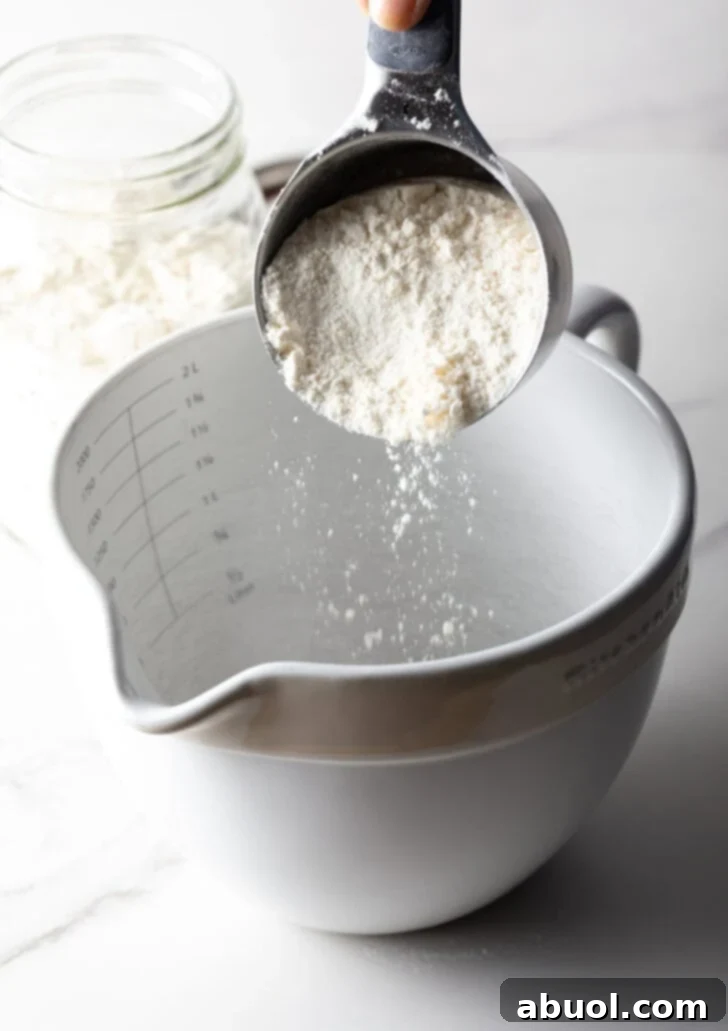 Pouring pancake mix into a bowl