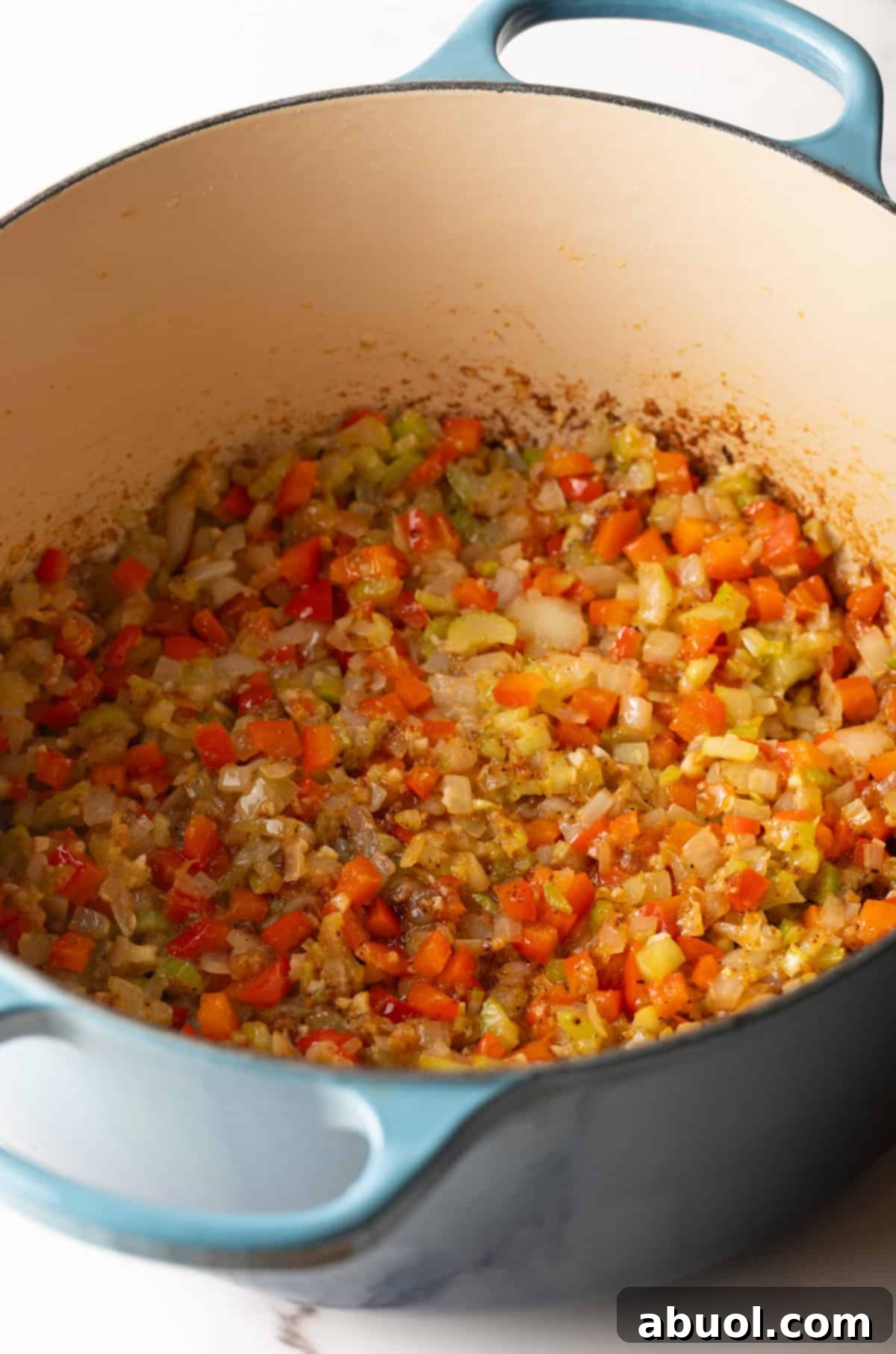 Vegetables sautéing in a pot