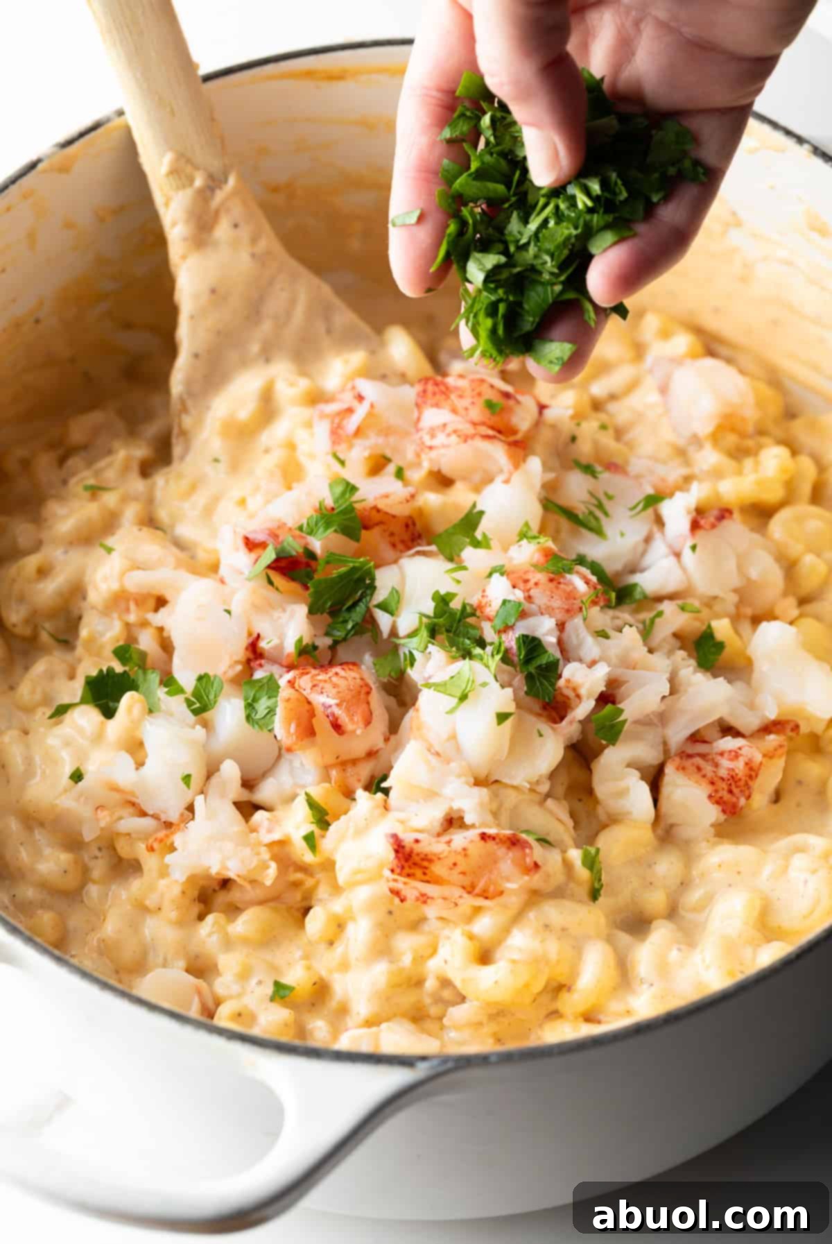 Adding lobster and parsley