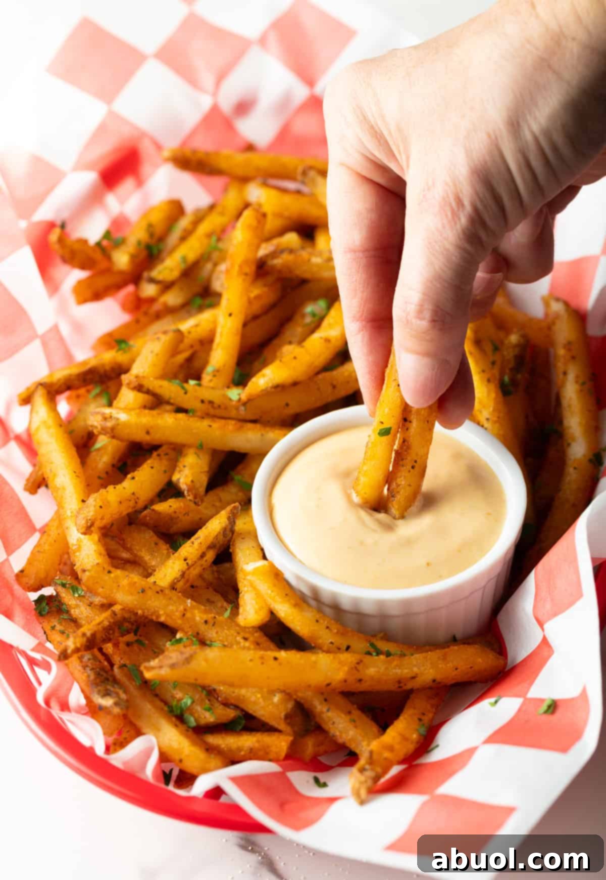 Crispy French fries with a ramekin of homemade French fry dipping sauce.