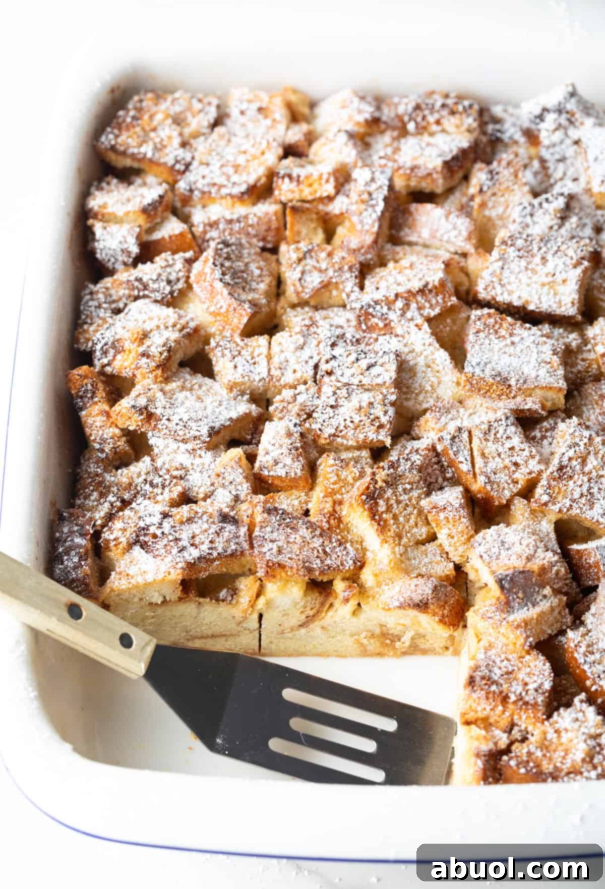 Slices of French Toast Casserole Being Removed