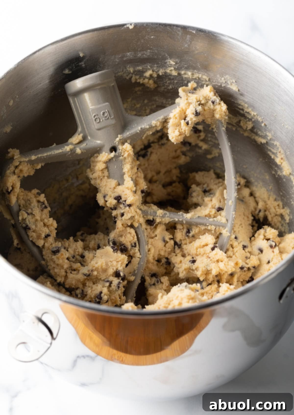 The chocolate chip walnut cookie dough being mixed.