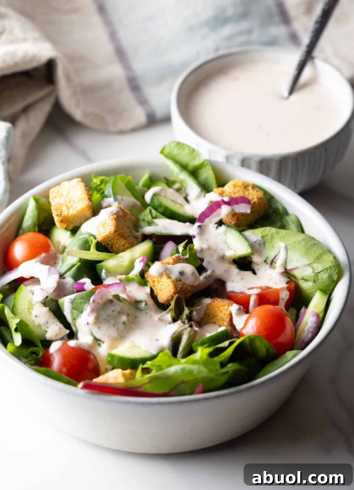 Fresh garden salad topped with homemade Parmesan Peppercorn Dressing