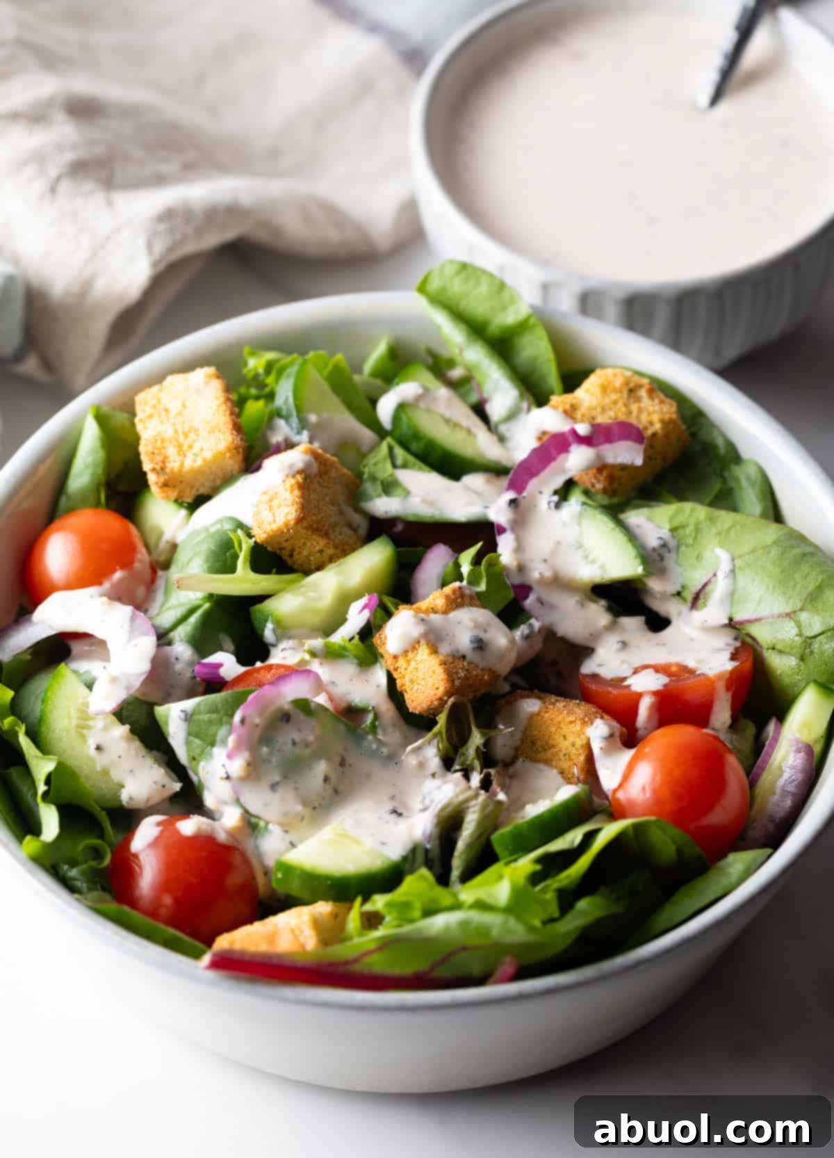 A fresh garden salad topped with homemade Parmesan Peppercorn Dressing