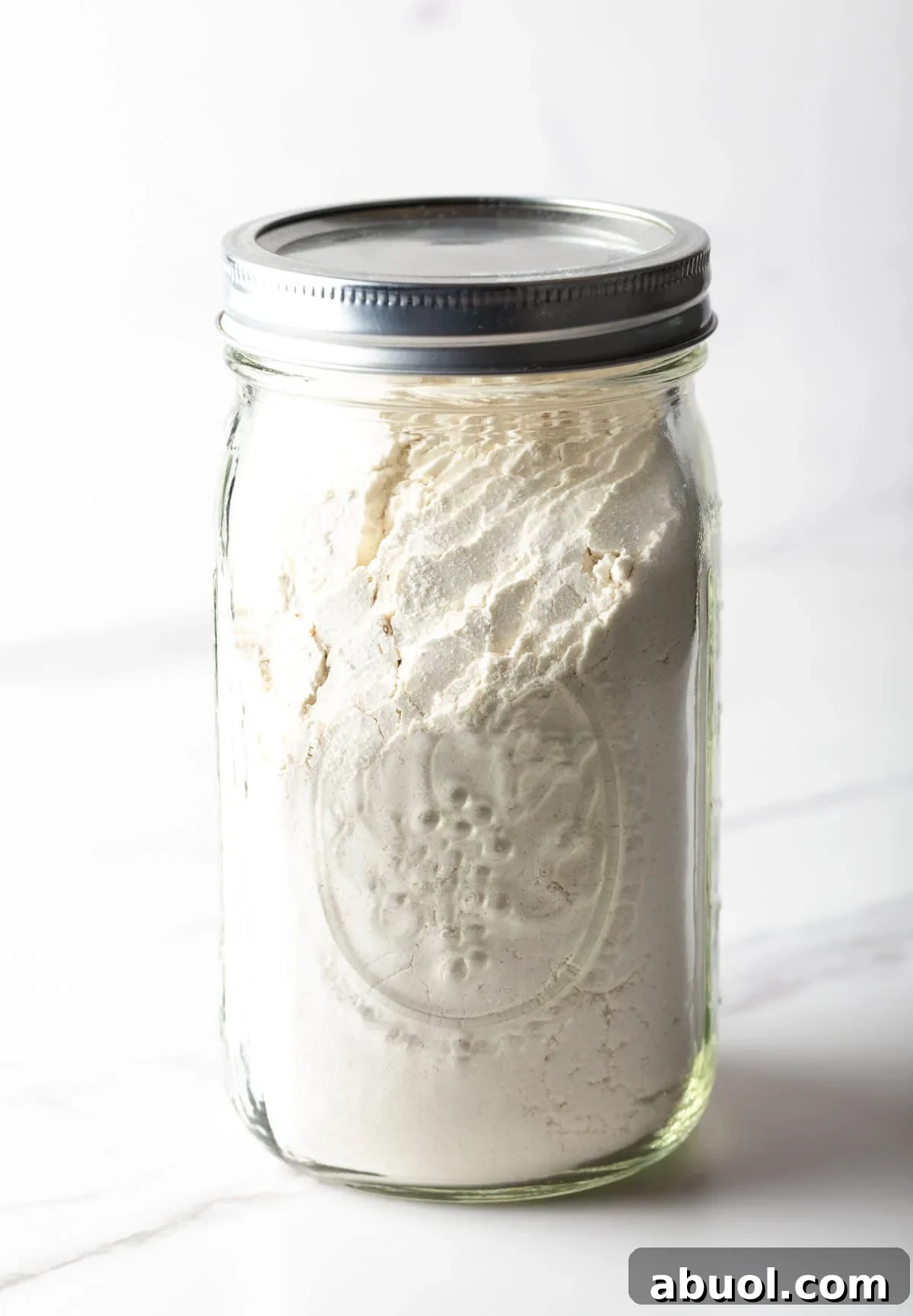 A mason jar filled with buttermilk pancake mix.