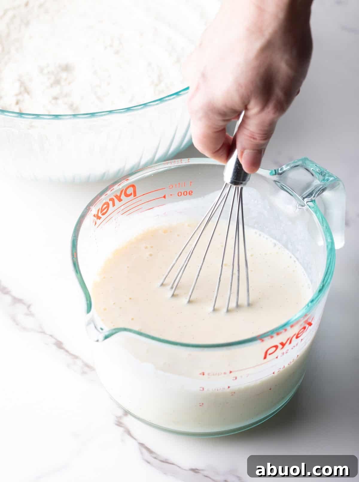 mixing the wet ingredients for griddle cakes