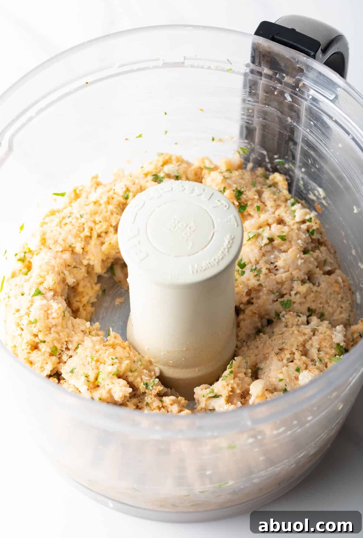 A fish burger mixture that has been blended in a food processor, ready to turn into fish patties.