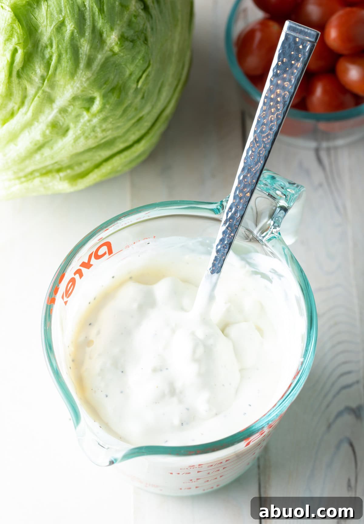 homemade blue cheese dressing mixed in bowl with spoon